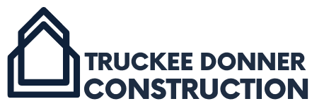 TDC-blue-logo Logo of Truckee Donner Construction with a stylized house design beside the company name in bold text.